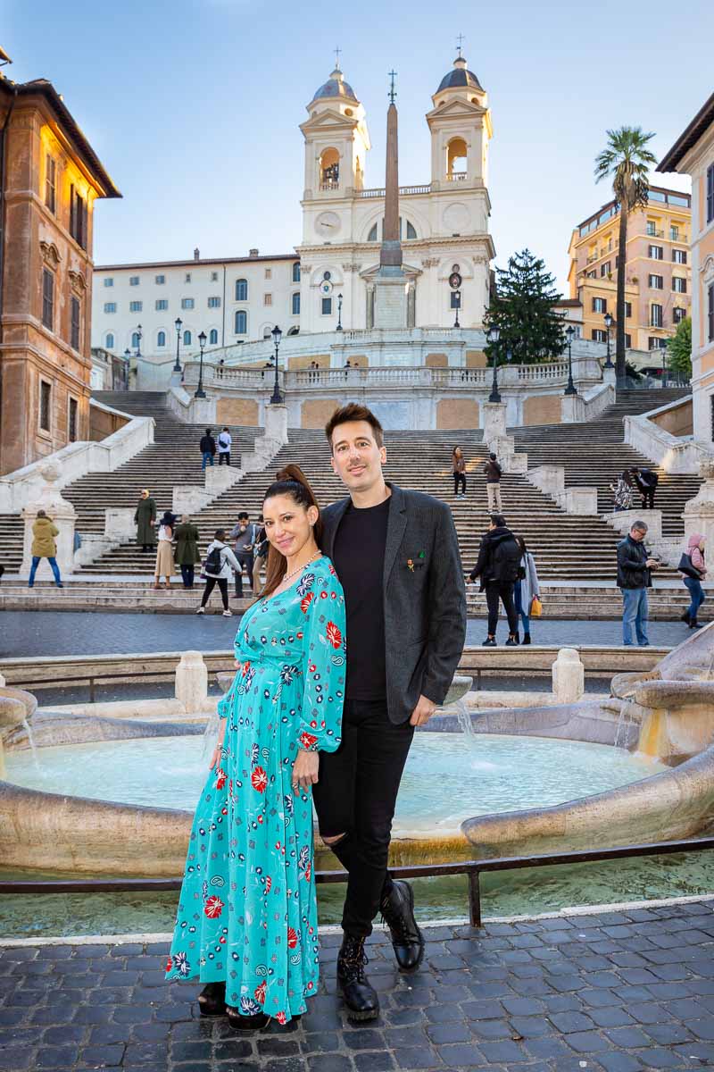 Standing portrait in front of Trinita' dei Monti church and the barcaccia fountain 