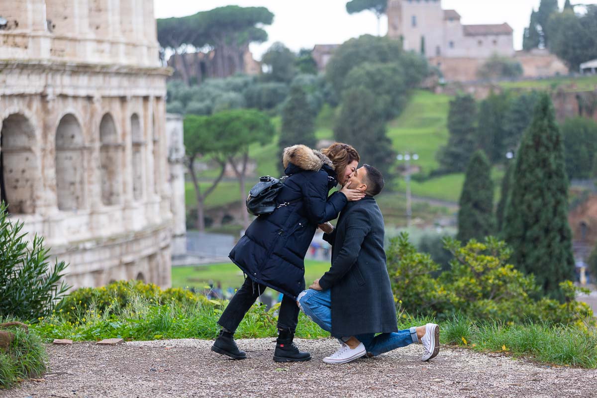 Kissing in color at the Roman Coliseum in Rome Italy