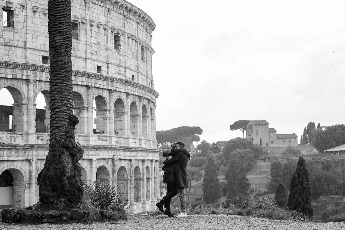 Asking the big question on a hillside overlooking the ancient colosseum from above