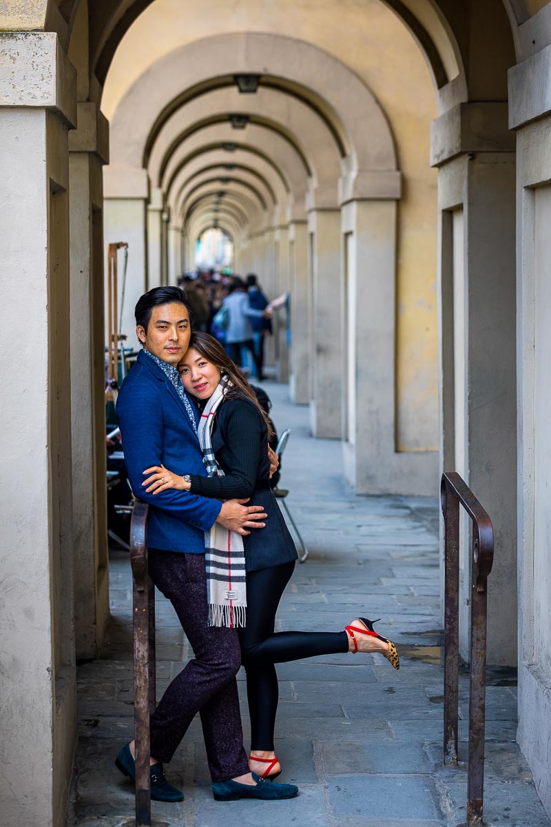 Couple posing shot taken underneath the lungarno porticos