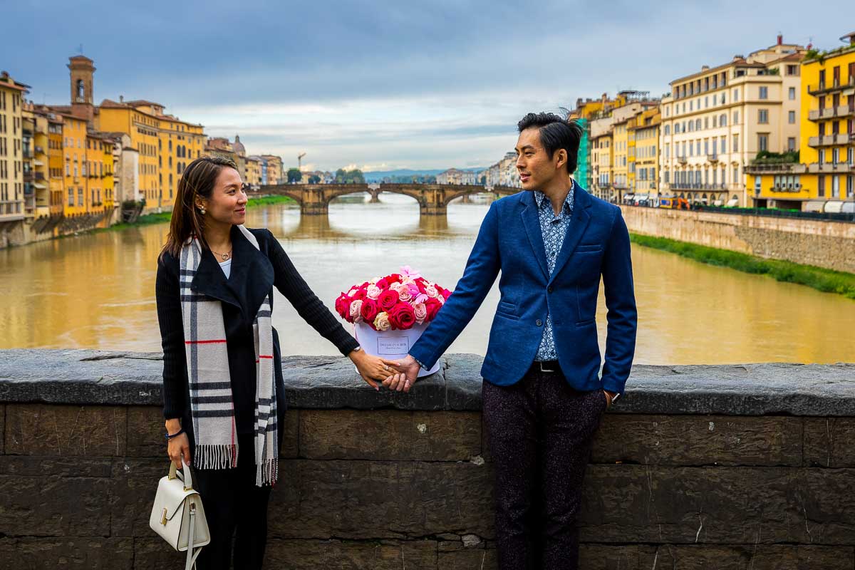 Engagement couple photoshoot in Florence over the Arno river in Italy. Florence Couple PhotoShoot