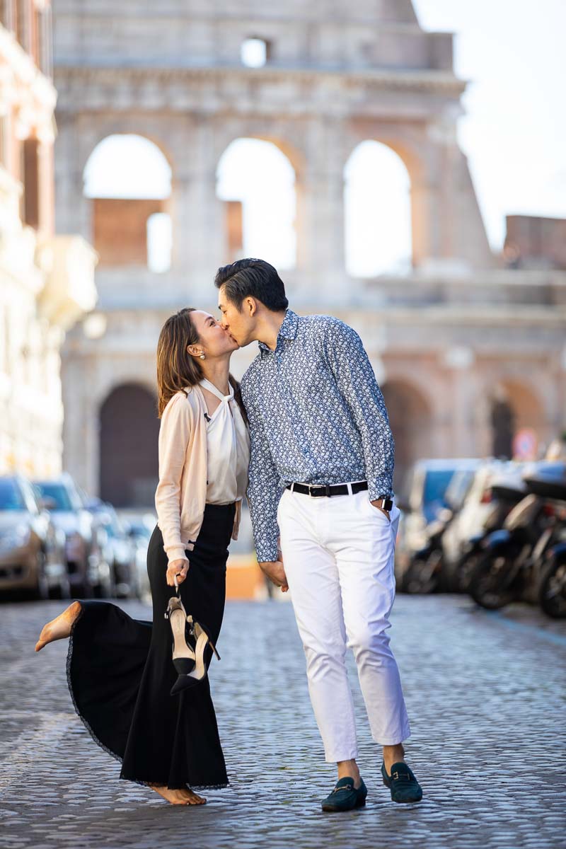 Walking while kissing at the Roman Coliseum 