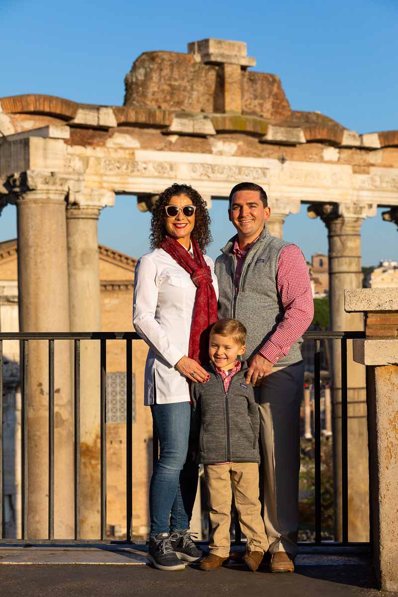 Family portrait imae taken at the ancient roman forum in the backdrop 