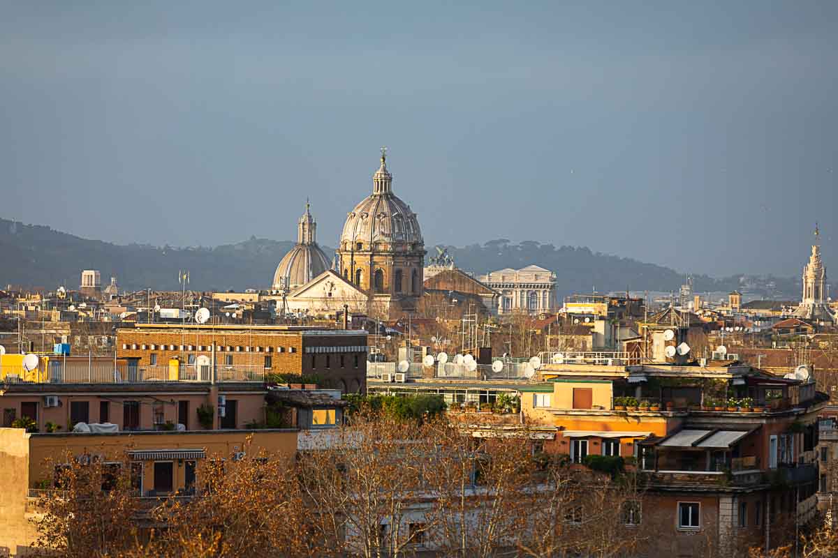 The Rome city skyline photographed at sunset from the Aventine hill. Rome, Italy