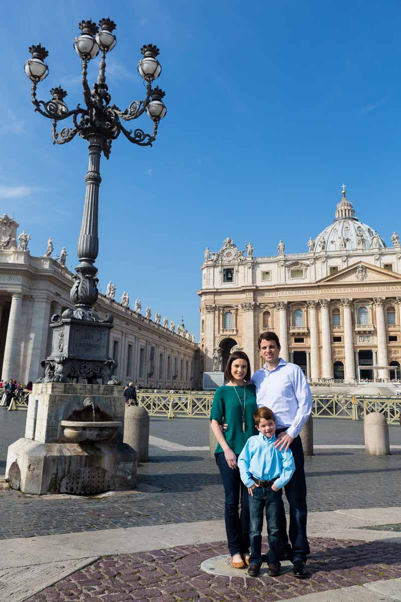 Group picture of three taken in Saint Peter's square in front of the Cathedral