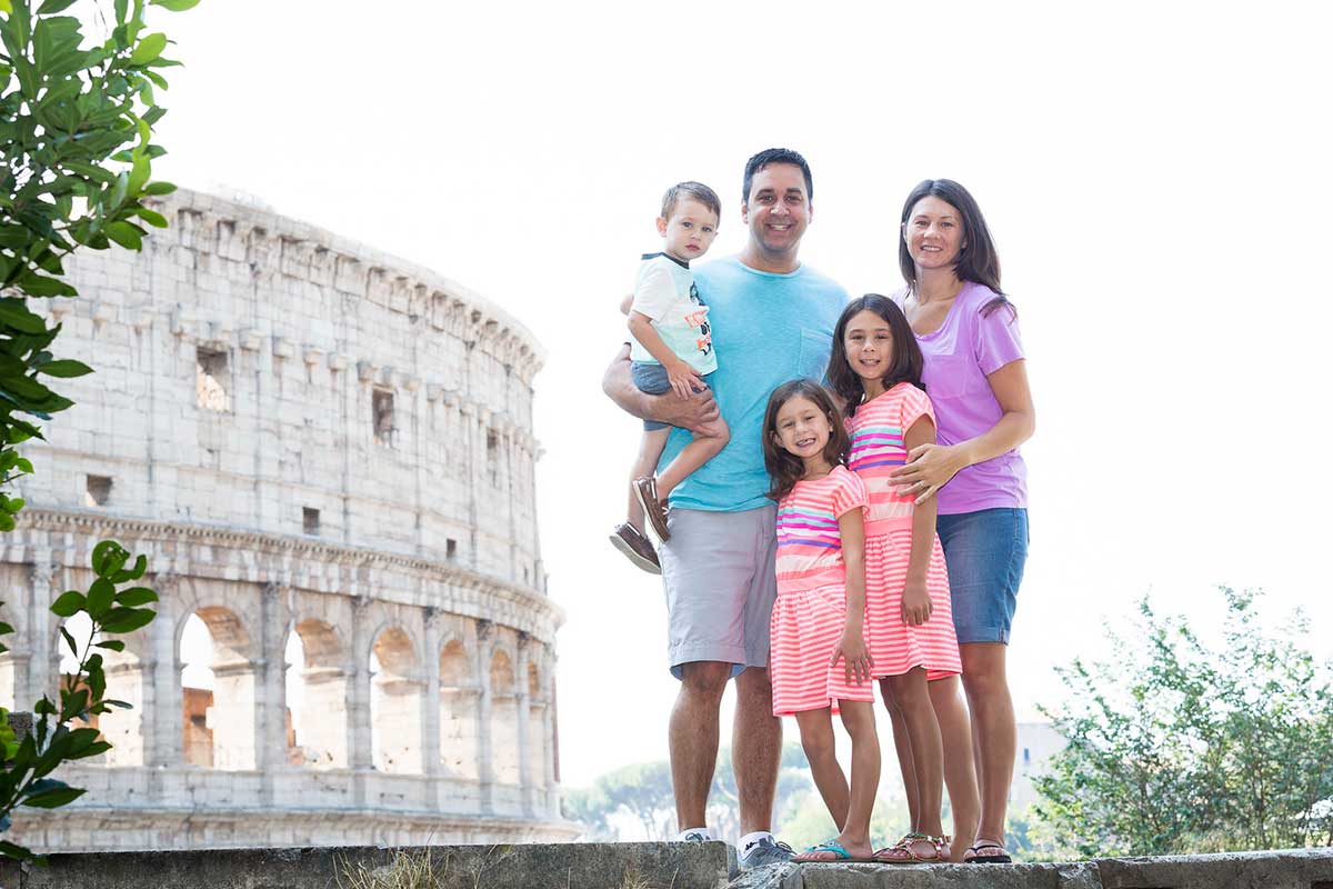 Group portrait photography taken at the Roman Colosseum during a photoshoot 