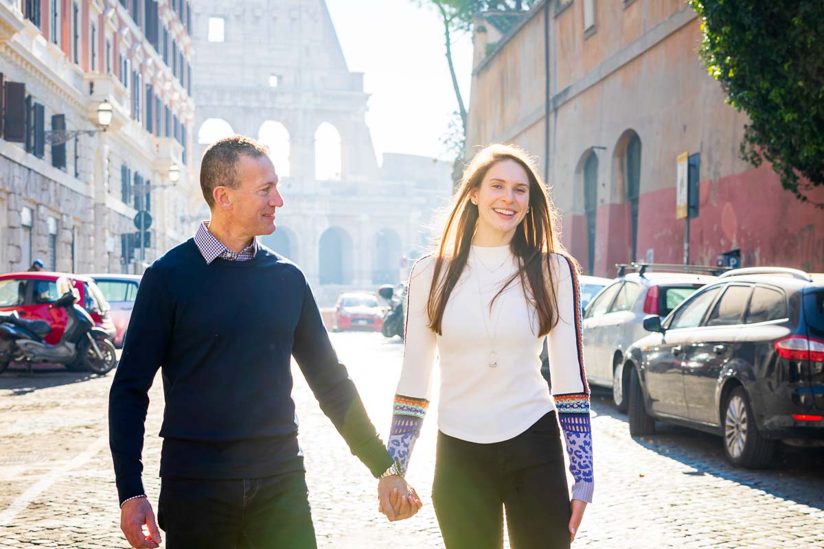 Close up couple portrait while walking together before the Coliseum 