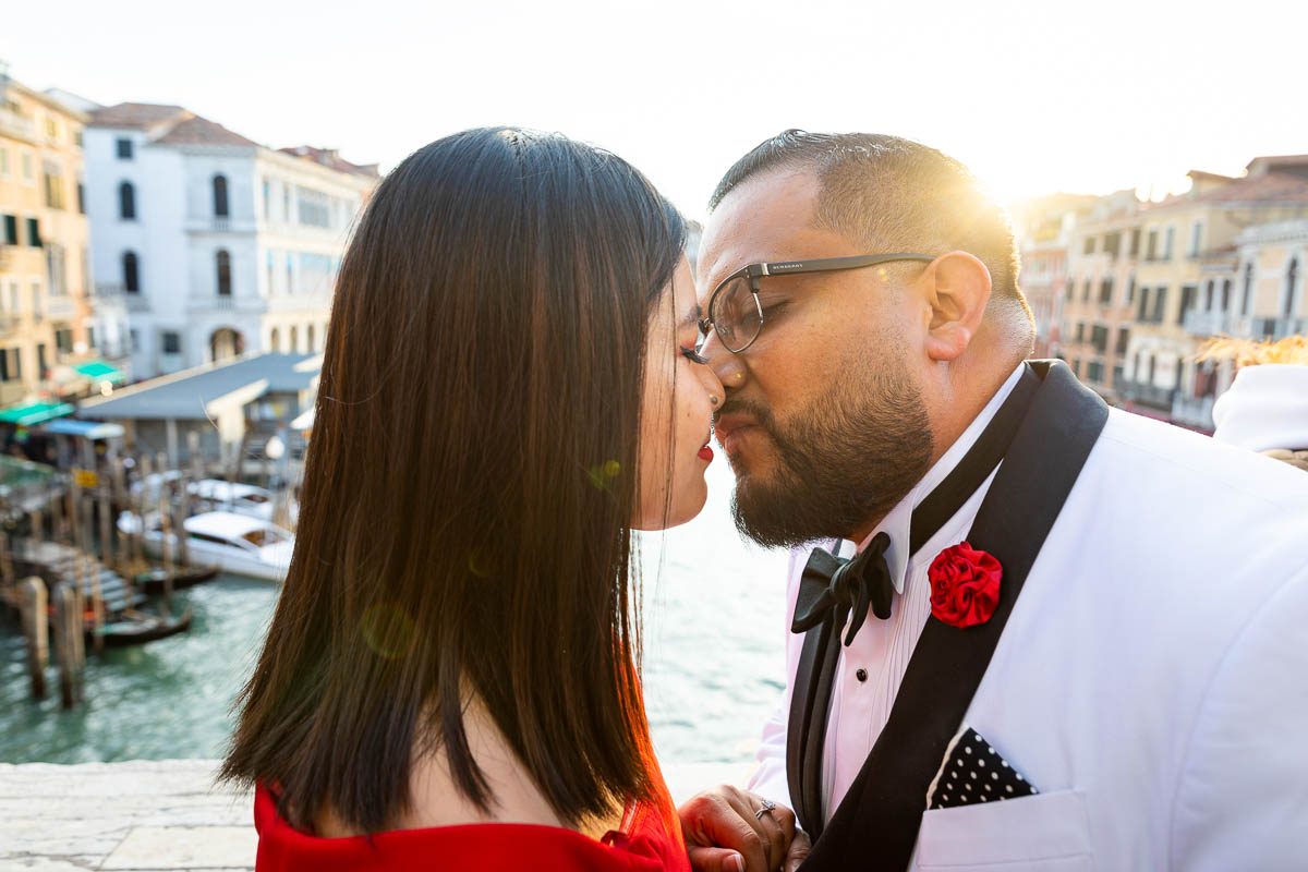 Couple portrait kissing at sunset 