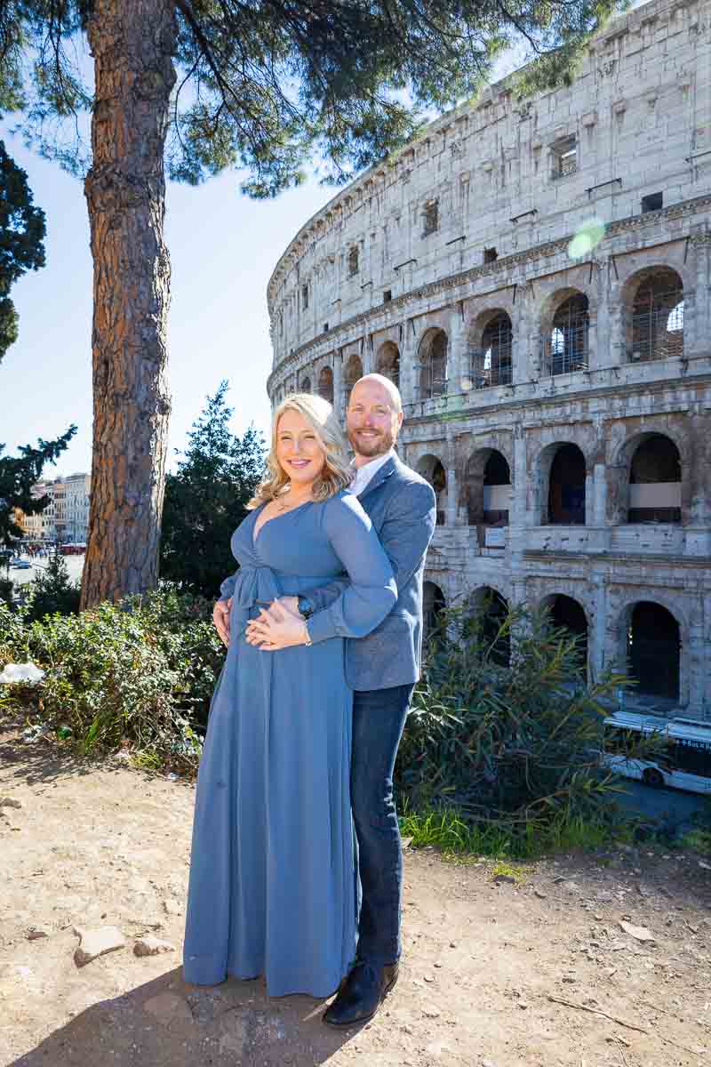 Posed couple portrait in front of the Coliseum in central Rome