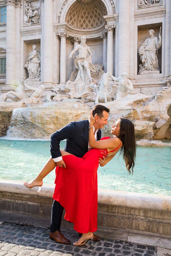 Posing in front of the Trevi fountain during a Couple Photo Shoot in Rome