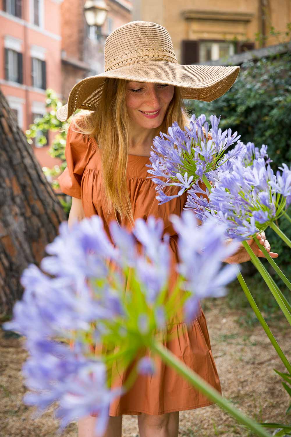 Smelling fresh blue during a fashion solo photo shoot in Italy