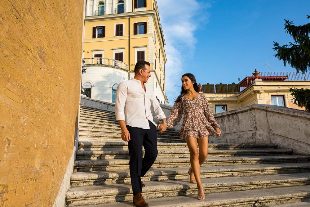 Walking down the Spanish steps staircase hands in hands 