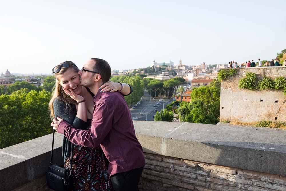 Couple kissing after engagement to be married in the eternal city 