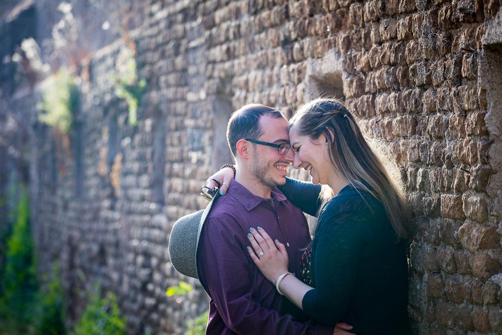 Together and in love in Italy. Photoshooting by ancient roman walls 