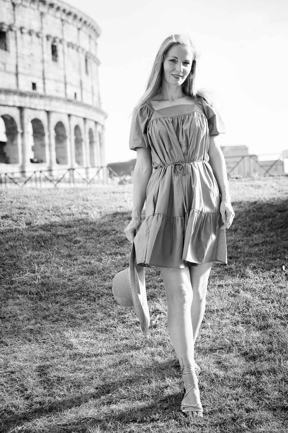 Strolling down in front of the Coliseum in black and whitephotography