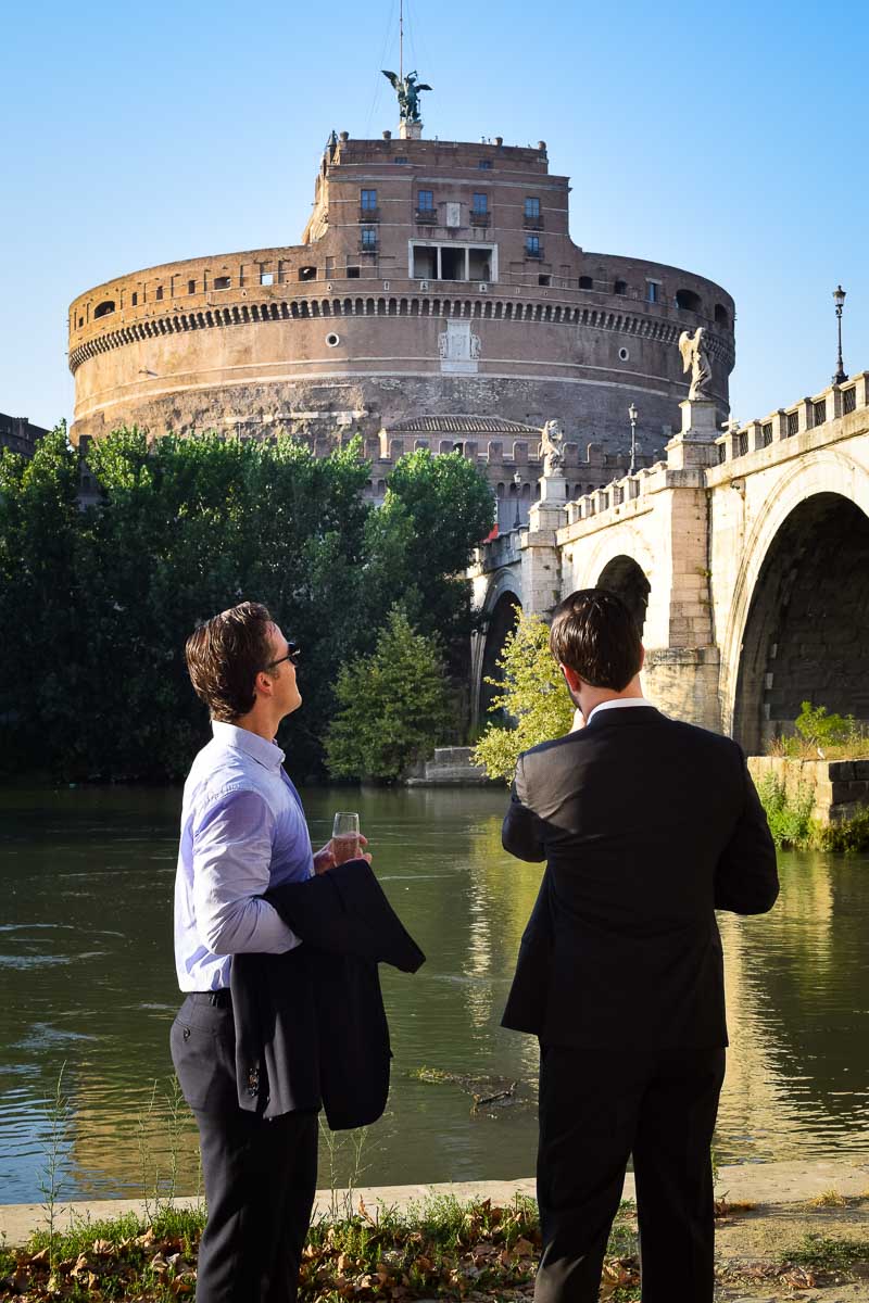 Same sex couple taking pictures together after and engagement session in Italy