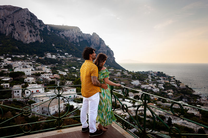 Looking at the sunset view together over Capri island