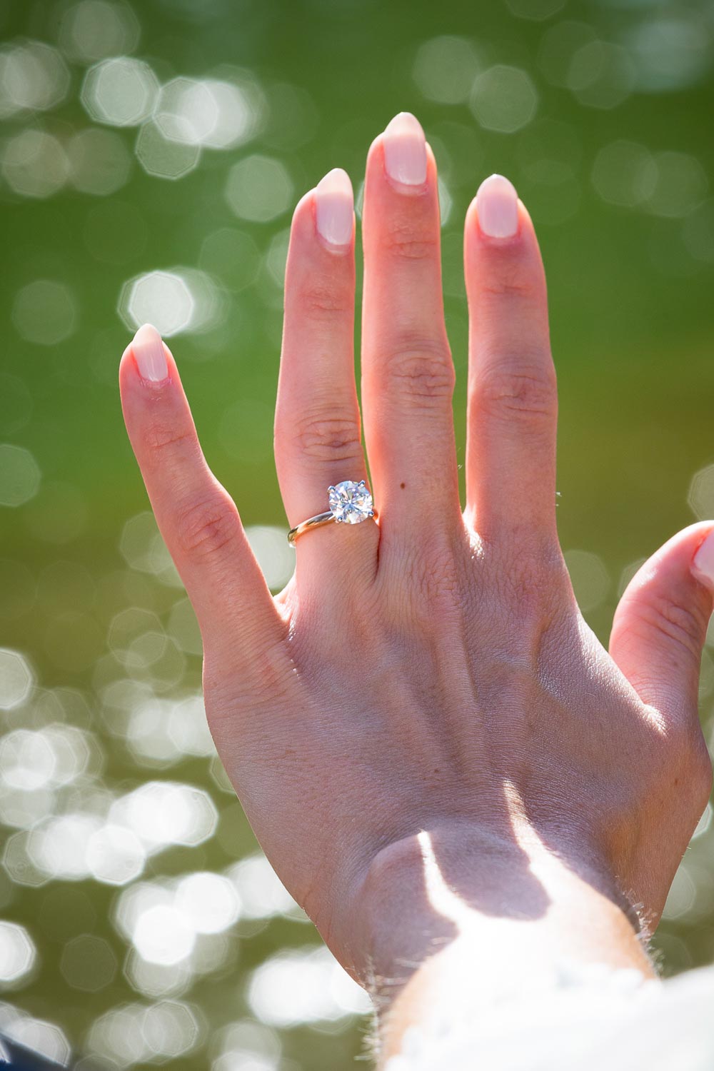 Close up the engagement ring wore on the hand