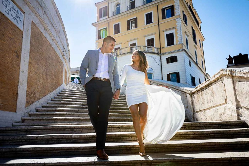 Couple photography in Rome while walking down the spanish steps by the Andrea Matone photographer studio