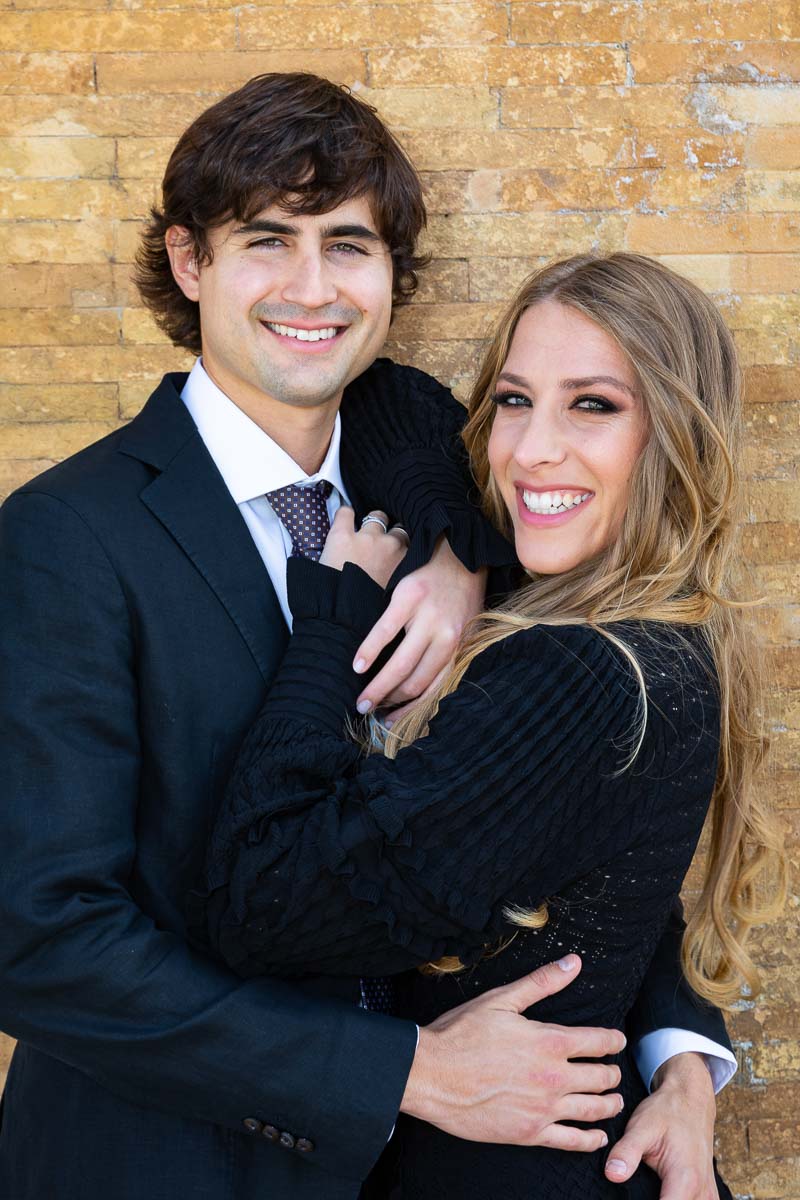 Close up portrait of an engaged couple smiling together 