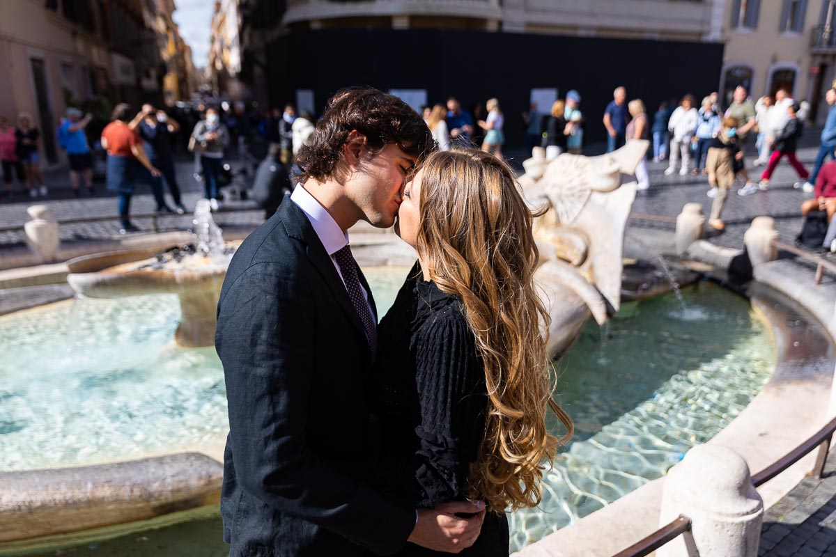 Kissing by the Barcaccia water fountain found at the bottom of the Spanish steps