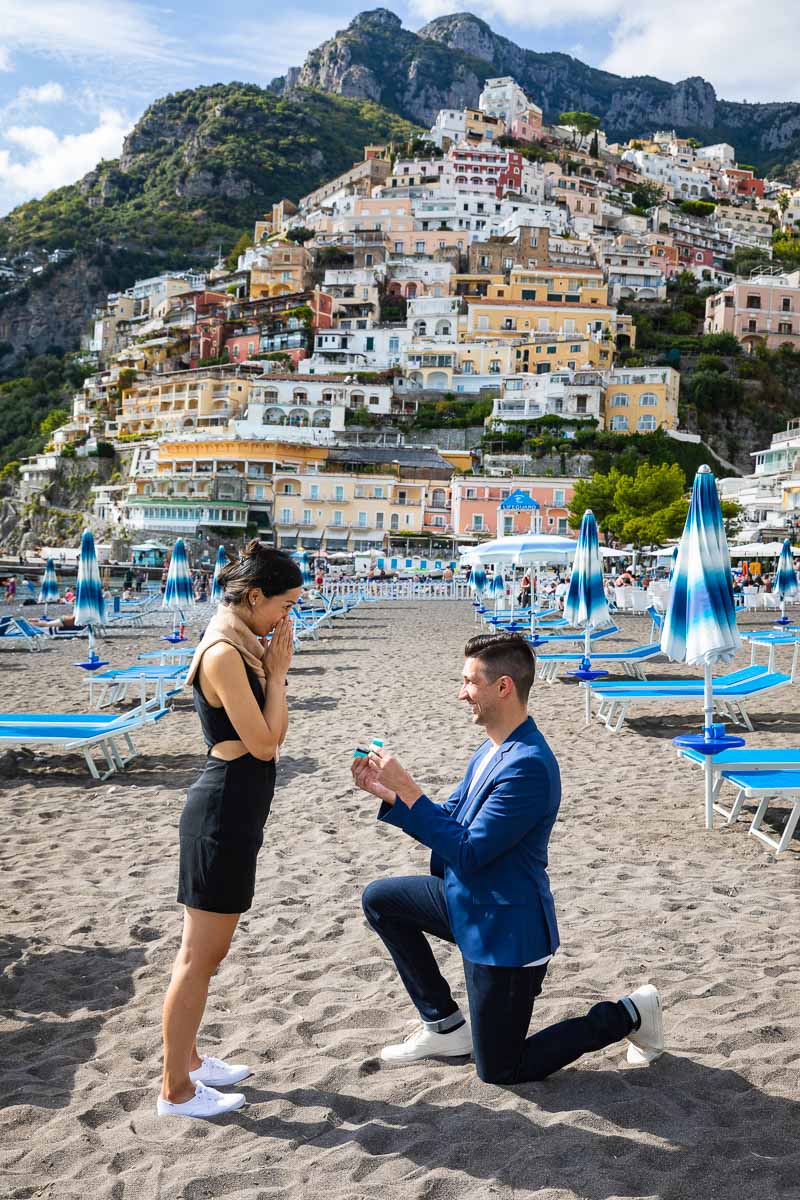 Jumping for joy during and engagement session after a surprise proposal