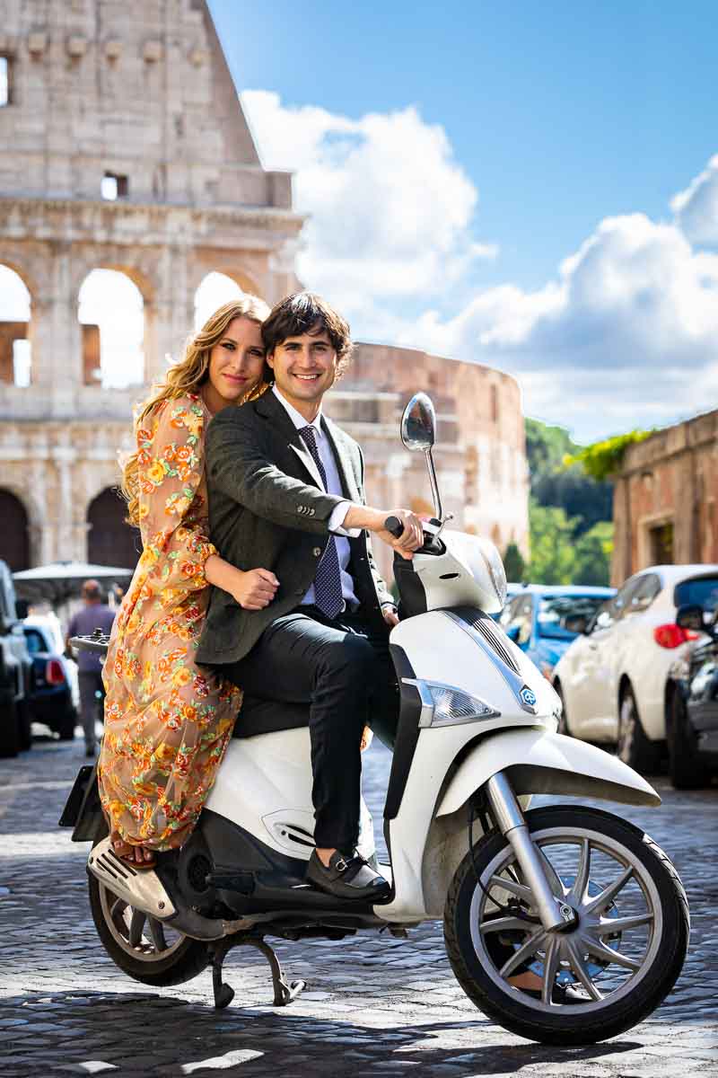 Roman Colosseum photo shoot white riding a white piaggio scooter in the streets of Rome Italy. Rome Couple Photo Shoot