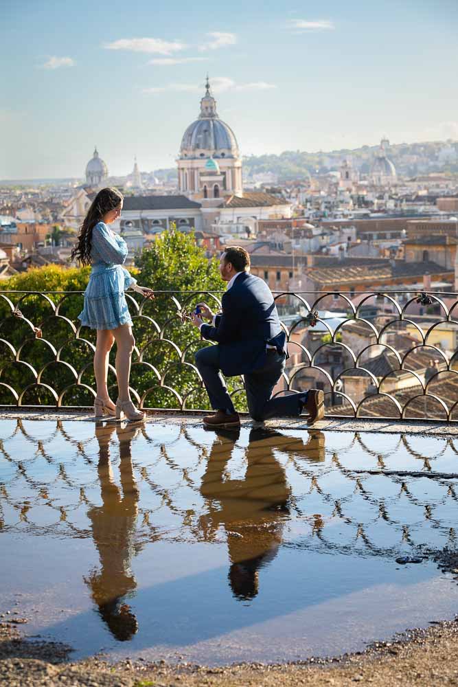 Surprise wedding marriage proposal photographed overlooking the Rome cityscape from the above Parco del Pincio terrace