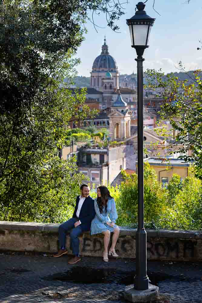 Engagement photo session sitting down before the ancient roman city 