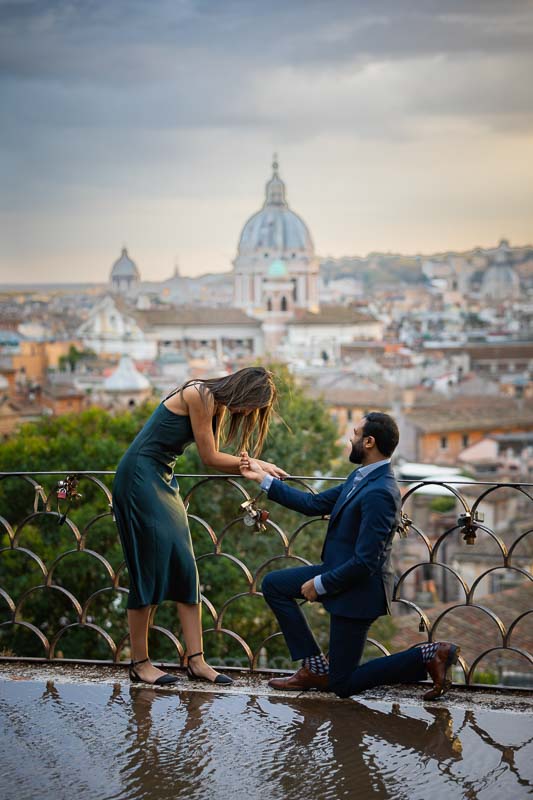 Proposal image 1. Kneeling down and showing the engagement ring