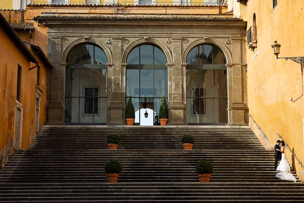 Artistic image of bride and groom taken on scenic staircase found in Piazza del Campidoglio 