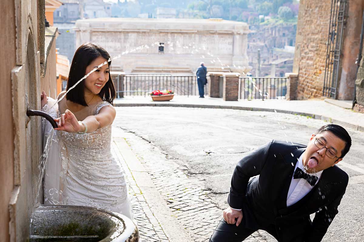 Quick water drink stop during a wedding photo session in the ancient roman city