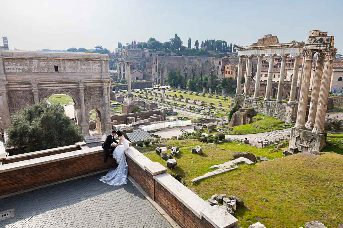 Wedding photography from Rome Italy image taken from above overlooking the ancient roman forum from above 