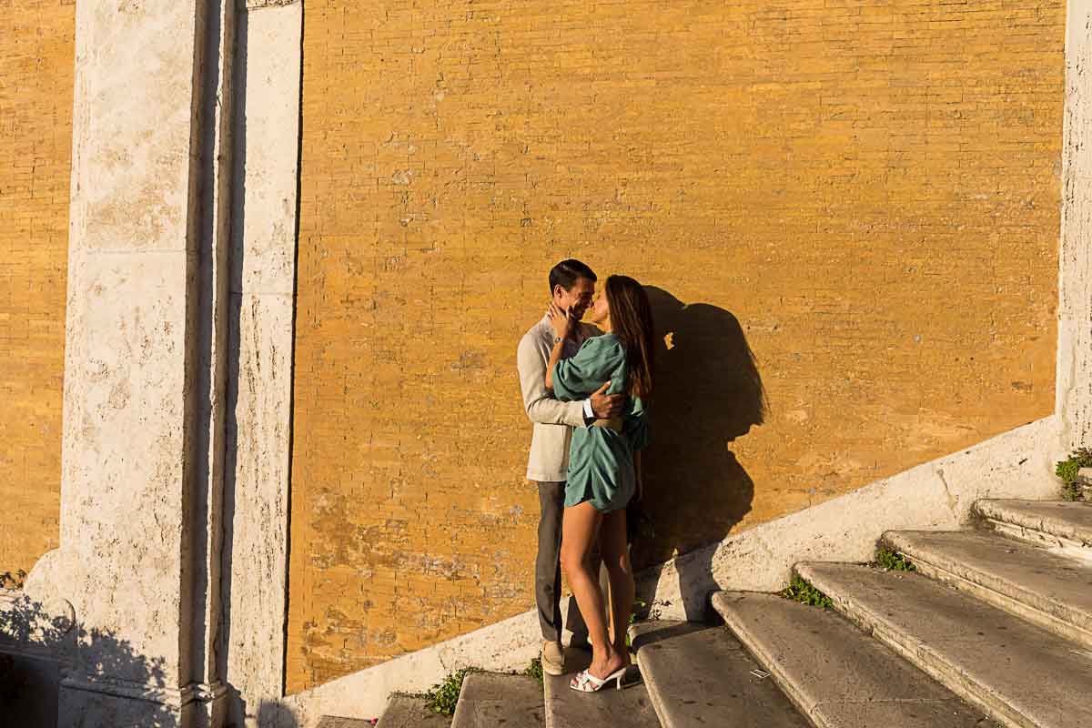 Romance on the Spanish steps. Couple together at sunset