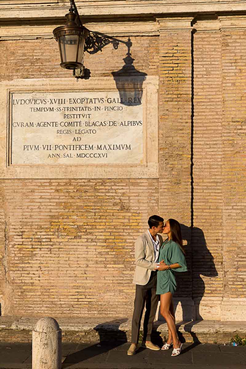 Couple kissing at the Spanish steps in Rome Italy 