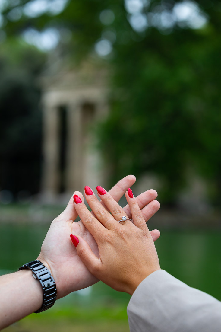 Engagement ring close up with the temple out of focus in the background