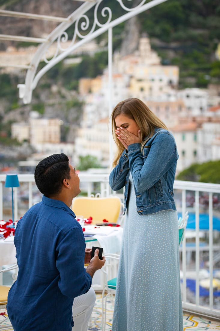 Proposing on a rooftop restaurant terrace with a view