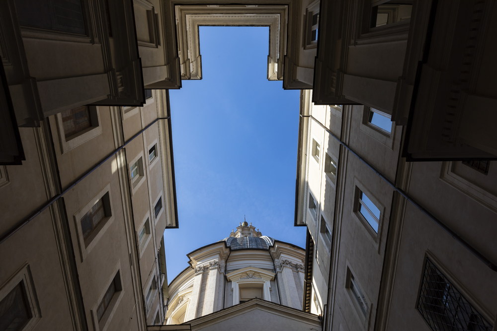 View of the above Church Sant'Agnese dome from the courtyard of the Eitch Borromini hotel in Rome's Piazza Navona in Italy 