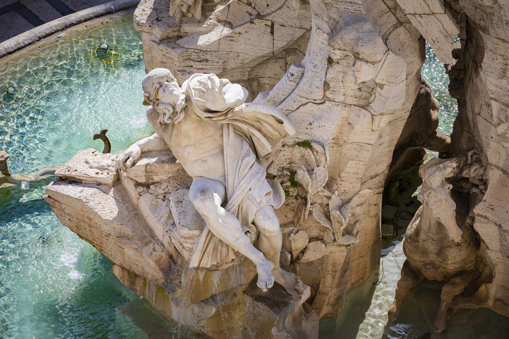 A view of a water fountain detail of Piazza Navona's four river fountain in Rome Italy