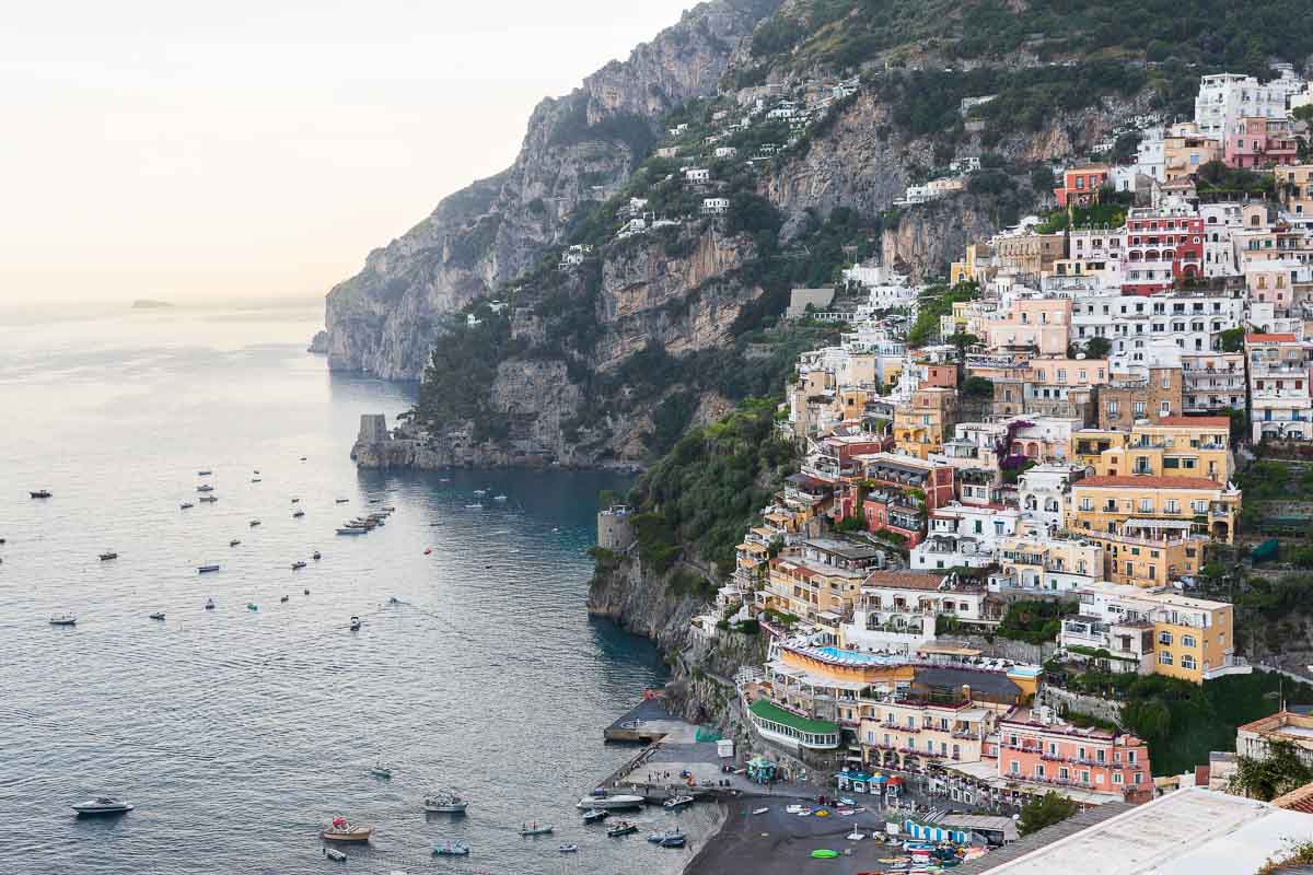 The town of Positano photographed at dusk from a restaurant terrace