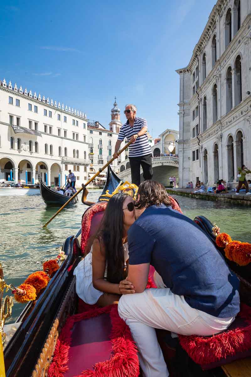 The she said yes moment to a gondola proposal in Venice Italy