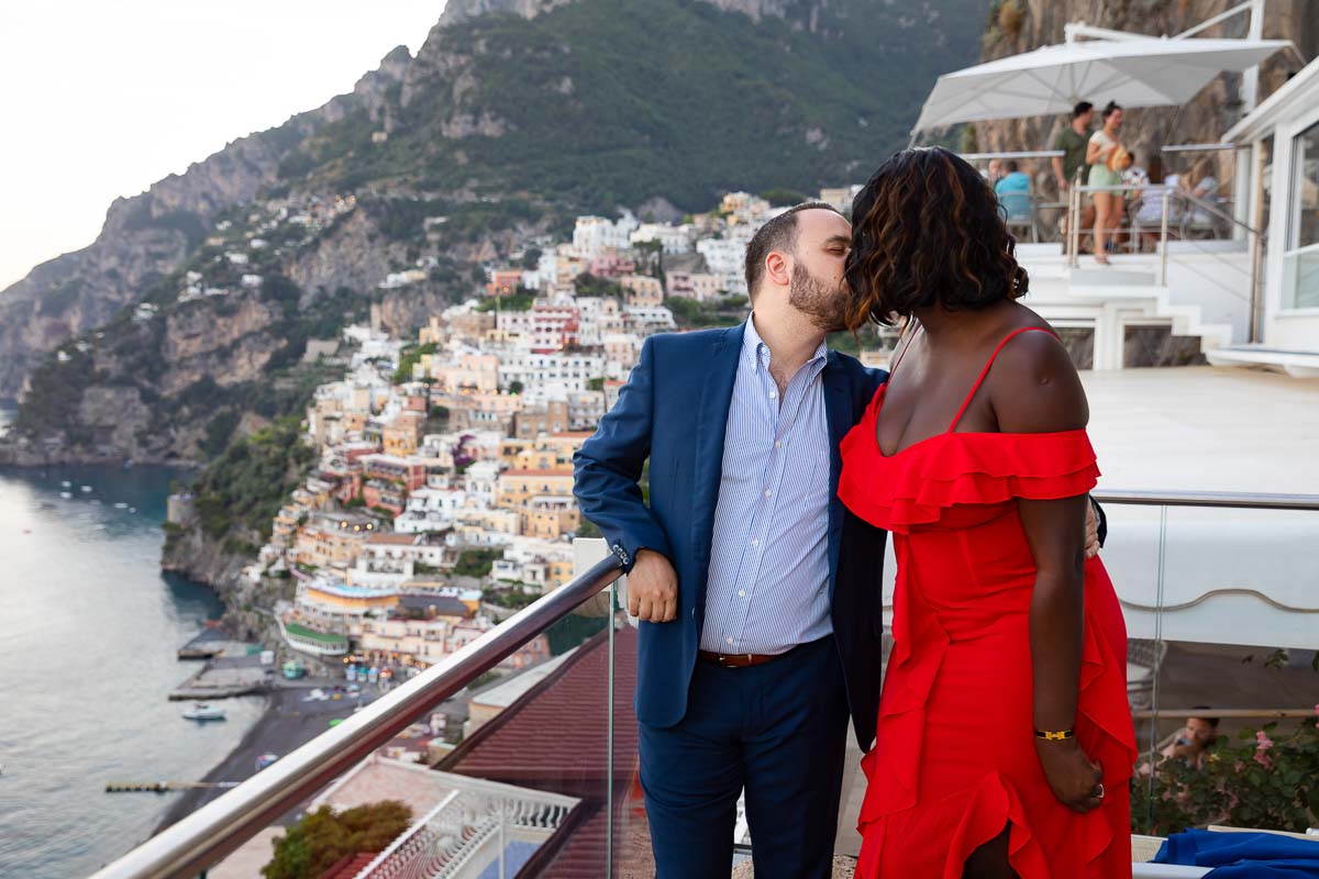 Just engaged on the Amalfi coast. Couple kissing after a romantic proposal