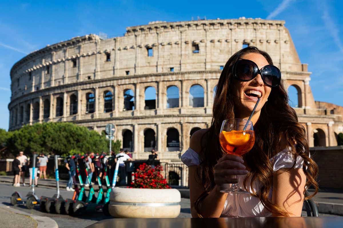 Spritz drink break. Taking fun pictures in Rome during a solo fashion photoshoot at the Roman Coliseum