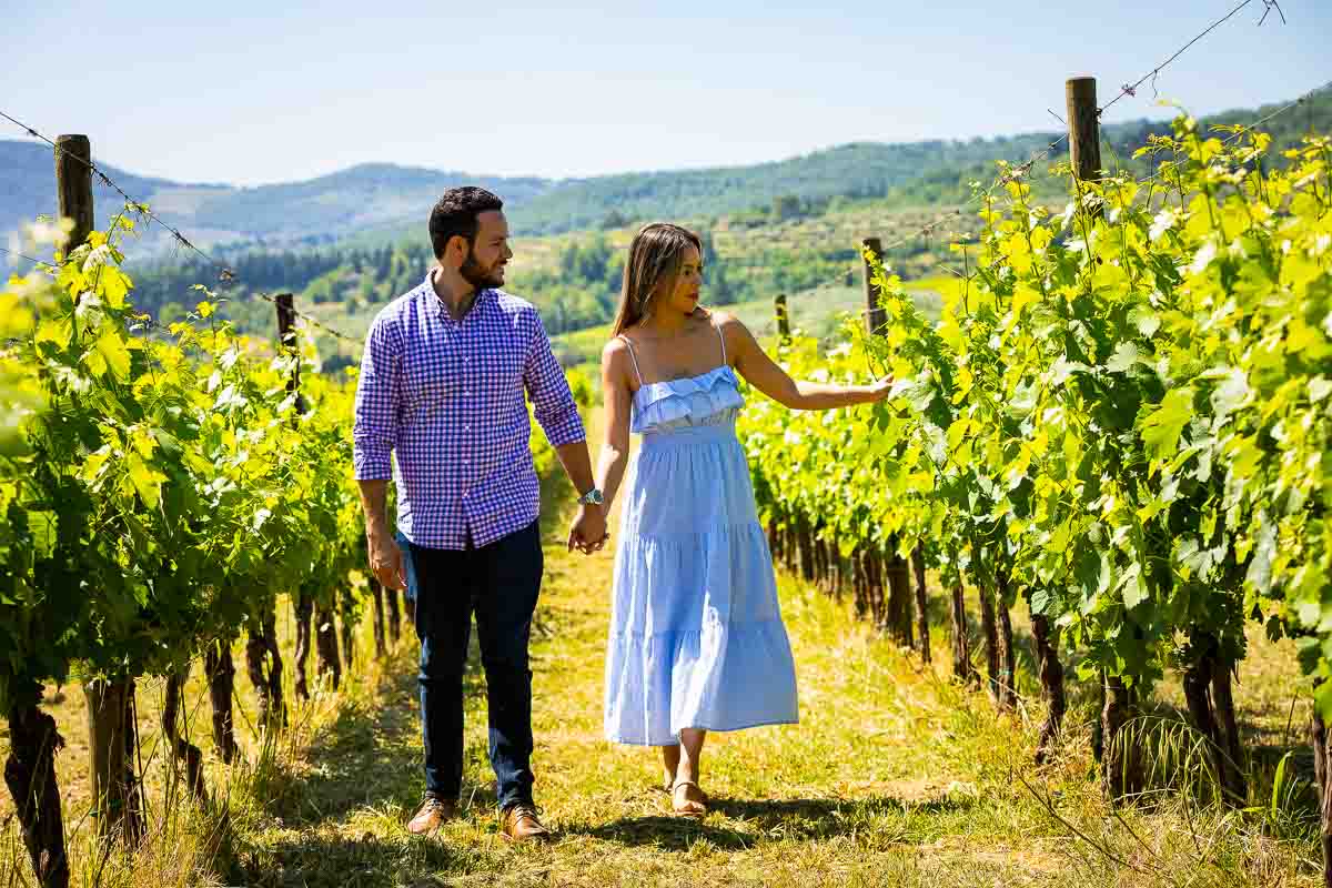 Walking among the rows of vineyards while taking some great couple photography