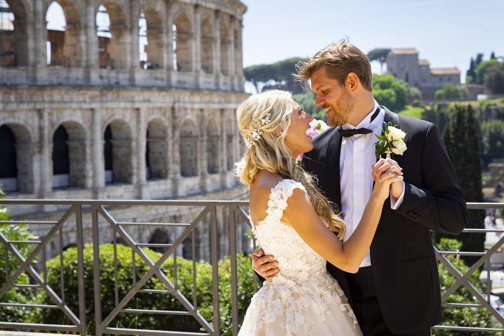 Newlyweds first dance at the Roman Colosseum in Rome Italy