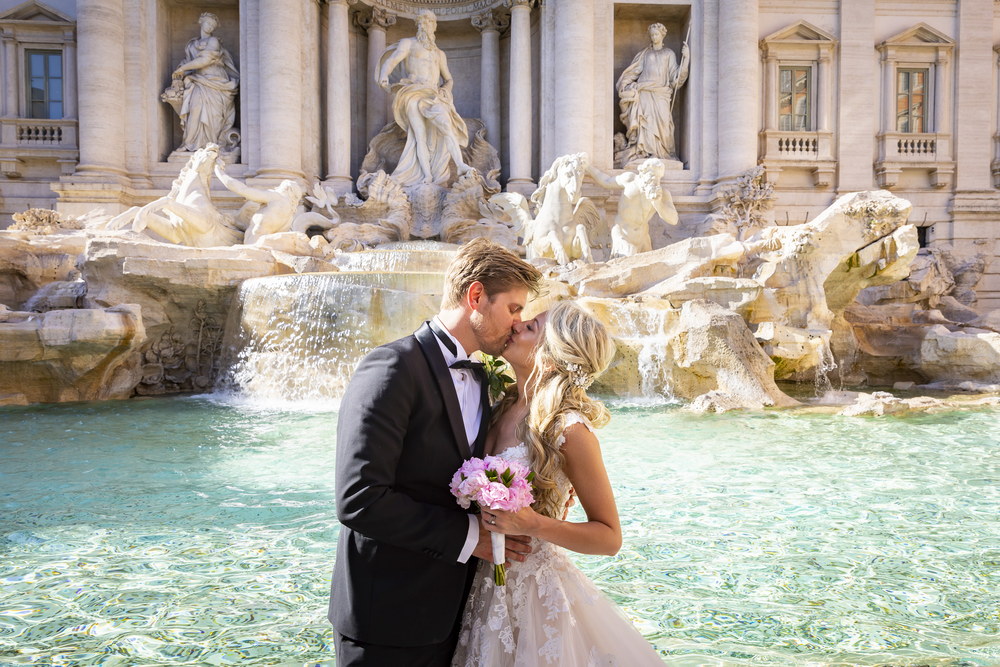 Portrait picture of the newlyweds taken at the Trevi fountain. Rome, Italy