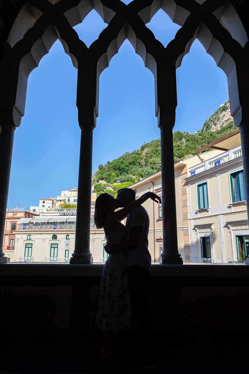 Silhouette image of a couple together in love at the Duomo of Amalfi in Italy