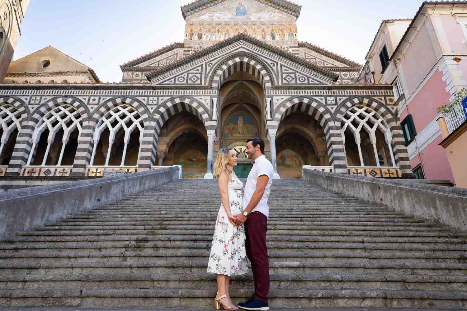 Duomo if Amalfi photoshoot posed on the staircase leading up to the Cathedral 