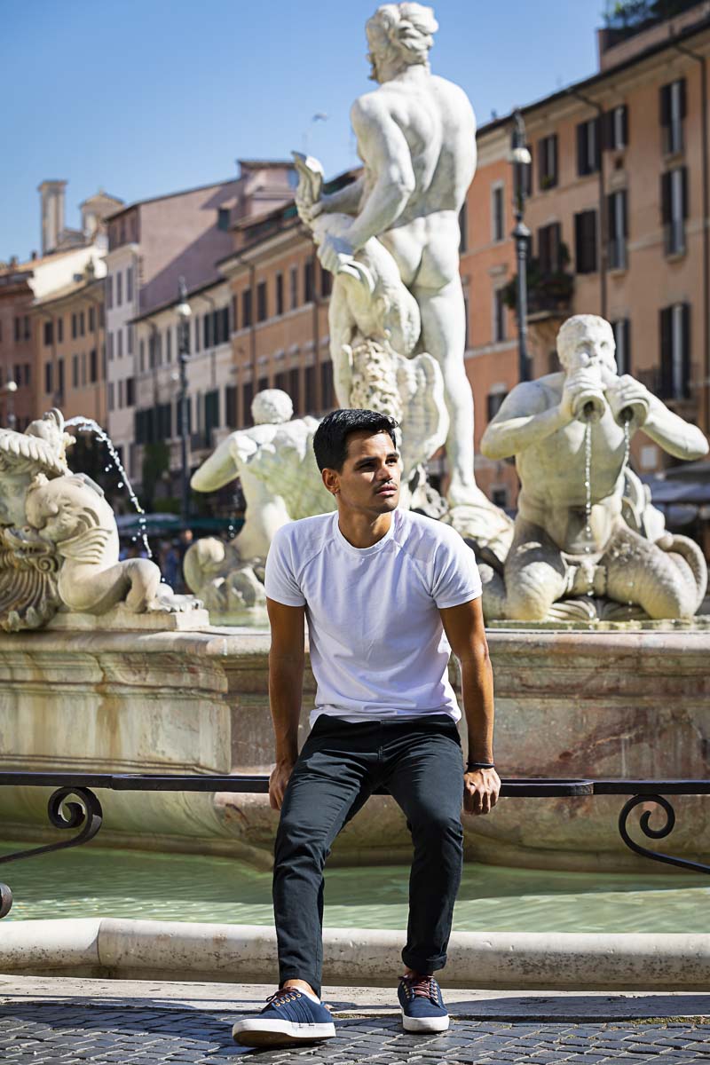 Solo photography: male model portrait sitting down by the Morish fountain found in Rome's Piazza Navona 