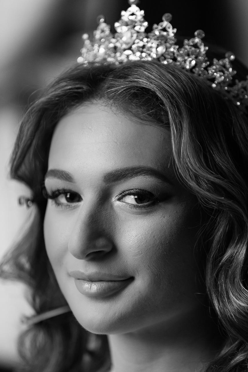 Black and white bride portrait taking in natural light by the window during the hotel bridal preparation